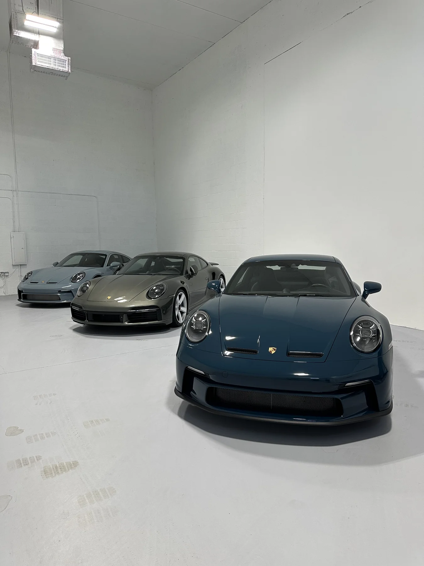Vehicles inside the Dillux Auto Spa studio
